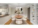 Elegant dining room with hardwood floors, built-in shelving and modern light fixtures at 955 Juniper Ne St # 4331, Atlanta, GA 30309