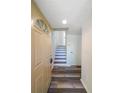 Light and bright entryway with stairs and neutral flooring at 1107 Riverbend Club Se Dr, Atlanta, GA 30339