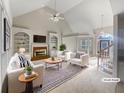Spacious living room with built-in shelving and a fireplace at 3905 Colonial Sw Trl, Lilburn, GA 30047