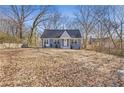 Newly renovated home with gray siding and landscaping at 1974 Browns Mill Se Rd, Atlanta, GA 30315