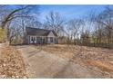 Cute gray house with a gravel driveway at 1974 Browns Mill Se Rd, Atlanta, GA 30315
