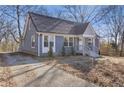 Updated home with gray exterior and a spacious yard at 1974 Browns Mill Se Rd, Atlanta, GA 30315