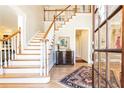 Two-story foyer with hardwood floors and elegant staircase at 63 Habersham Cove Nw Ln, Atlanta, GA 30305