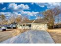 House exterior showcasing a large yard and driveway at 758 Shoreline Se Trl, Conyers, GA 30094
