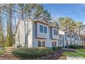 Side view of charming light blue townhome nestled in trees at 41 Doranne Se Ct, Smyrna, GA 30080