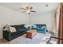 Spacious living room with teal couches and wood coffee table at 1144 Kipling Se St, Atlanta, GA 30315