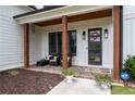 Front porch with brick flooring, wooden posts, and comfortable seating at 2193 Bliss Ln, Marietta, GA 30062