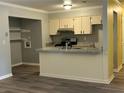 The kitchen features granite countertops, stylish cabinetry, modern flooring, and stainless steel appliances at 22 Cardinal Ln, Jonesboro, GA 30238