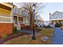 Townhome community with manicured landscaping and walkways at 1072 Green St, Roswell, GA 30075