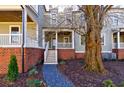 Townhome exterior with front porch and landscaping at 1072 Green St, Roswell, GA 30075