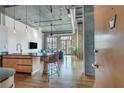 Modern kitchen with island and exposed brick wall at 3235 Roswell Rd # 709, Atlanta, GA 30305