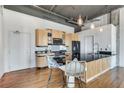 Modern kitchen with wood cabinets and granite countertop at 3235 Roswell Rd # 709, Atlanta, GA 30305