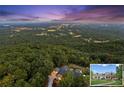 Expansive property with a stunning hilltop view and lush surrounding greenery at 101 Barker Rd, Cumming, GA 30040