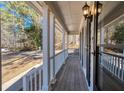 Long front porch with white railings offers a relaxing space at 4620 Sammy Dr, Powder Springs, GA 30127