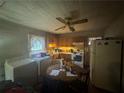 Cozy kitchen with wooden cabinets, standard appliances, an eat-in table, and laundry hookups at 3453 Woodlawn Cir, Tucker, GA 30084