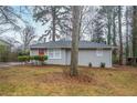 Cozy single-story home with a bright red door and well-maintained landscaping at 1658 Hollyhock Ter, Decatur, GA 30032