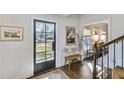 Elegant entryway featuring a glass-paneled door and hardwood floors at 4290 Valley Trail Se Dr, Atlanta, GA 30339