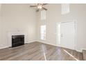 Open living room with vaulted ceiling, fireplace, and lots of natural light at 5541 Panola Pl, Lithonia, GA 30058