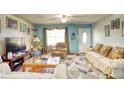 Living room with sofas, armchairs, and a geometric rug at 981 Meadowbrook Nw Ln, Conyers, GA 30012