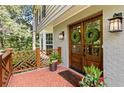 Inviting front entry with double doors, brick facade, and charming planters at 1130 Edgewater Dr, Atlanta, GA 30328