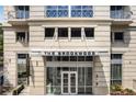 The Brookwood building entrance with modern architectural design at 1820 Peachtree Nw St # 607, Atlanta, GA 30309