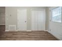 Front entry with wood-look flooring and closet at 540 Lakecourt Dr, Mcdonough, GA 30253