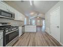 Modern kitchen with stainless steel appliances and granite countertops at 540 Lakecourt Dr, Mcdonough, GA 30253