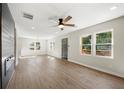 Open living room featuring hardwood floors and ceiling fan at 164 Chicamauga Sw Ave, Atlanta, GA 30314