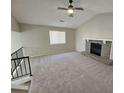 Spacious living room with a fireplace and vaulted ceiling at 1037 Forest Path, Stone Mountain, GA 30088