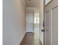 Light and bright entryway with wood-look flooring and neutral walls at 262 Depot Landing Rd, Auburn, GA 30011