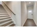 Modern staircase with dark wood risers and white treads at 262 Depot Landing Rd # 51, Auburn, GA 30011