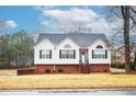 Front view of a charming two-story house with a yard at 2832 Fieldstone Se Dr, Conyers, GA 30013