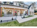 Beautiful front exterior showcasing a covered porch with exposed wood beams at 467 Concord Sw Rd, Smyrna, GA 30082