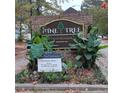 Pine Tree Condominium entrance sign with landscaping at 1604 Pine Tree Trl, Atlanta, GA 30349