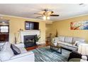 Spacious living room with hardwood floors, fireplace, and comfy seating at 6136 Winfield Ct, Tucker, GA 30084
