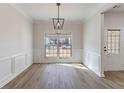 Bright dining room with hardwood floors and large window at 2839 Suttonwood Way, Buford, GA 30519