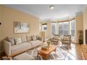 Spacious living room with neutral furniture and hardwood floors at 375 Highland Ave # 202, Atlanta, GA 30312