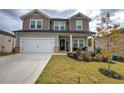 Two-story house with gray siding, white double doors, and a large yard at 419 Murphy Ave, Canton, GA 30114