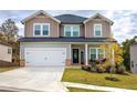 Two-story house with gray siding, a brick base, and a welcoming front porch at 419 Murphy Ave, Canton, GA 30114