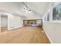 Spacious living room featuring a stone fireplace and built-in shelving at 680 Branch Valley Ct, Roswell, GA 30076