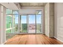 Bright living room with hardwood floors and city views at 250 Pharr Rd # 1516, Atlanta, GA 30305