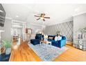 Spacious living room with hardwood floors, fireplace, and large windows at 3200 Saute Way, Avondale Estates, GA 30002