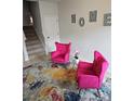 Cozy sitting area with plush pink chairs and a decorative 'HOME' sign at 2502 Polaris Sw Way, Atlanta, GA 30331