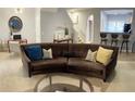 Living room with a curved sofa and neutral color scheme at 2025 Austin Park Cir, Decatur, GA 30032