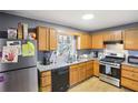 Functional kitchen features stainless steel appliances, granite countertops, and ample cabinet space at 65 Bridge Dr, Douglasville, GA 30134