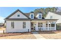 White two-story house with gray accents and a welcoming front porch at 102 Chestnut Dr, Canton, GA 30114