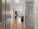 Inviting hallway leading to a bright living room with beautiful wood floors at 3481 Ne Lakeside Dr # 1508, Atlanta, GA 30326