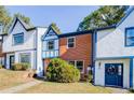 Brick front townhouse with blue door and landscaping at 3614 Main Station Sw Dr, Marietta, GA 30008