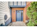 Blue front door entry to brick townhouse at 3614 Main Station Sw Dr, Marietta, GA 30008