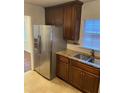 Kitchen features stainless steel refrigerator and granite counters at 1970 Wells Sw Dr, Atlanta, GA 30311